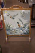 A WOVEN FIRE SCREEN DEPICTING DUCKS