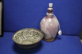 A POOLE TYPE BOWL TOGETHER WITH A LAMP