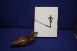 A CARVED WOODEN DUCK TOGETHER WITH 