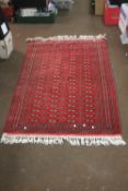 AN ANTIQUE WOOLEN RUG
