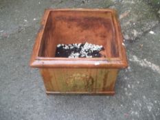A LARGE SQUARE TERRACOTTA PLANTER