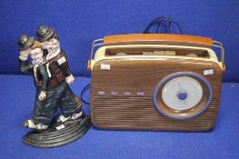 A VINTAGE BUSH RADIO TOGETHER WITH A LAUREL AND HARDEY DOOR STOP