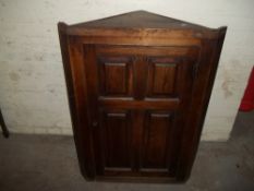 AN ANTIQUE PANELED WALL HANGING CORNER CABINET ConditonReport:THERE ARE SLIGHT SIGNS OF WOODWORM