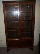 AN OAK LEADED BOOKCASE