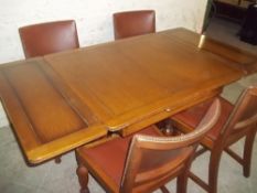 AN OAK 1930S DRAW LEAF TABLE AND 4 CHAIRS
