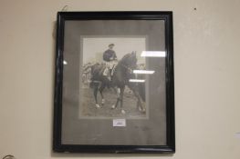 A FRAMED PHOTOGRAPH OF JOCKEY TOMMY WESTON ON HYPERION probably taken in 1933 when they won both The