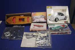 FOUR CAR MODEL KITS BY TAMIYA, MONOGRAM AND BUFFALO, together with a boxed Sutcliffe Zodiac