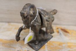 AN EARLY EASTERN METAL STUDY OF A HORSE WITH SADDLES - SOME ORIGINAL GILT REMAINING