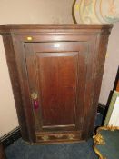 A GEORGIAN OAK HANGING CORNER CUPBOARD