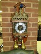 A DUTCH WALLCLOCK WITH TWO BRASS WEIGHTS