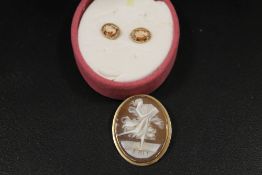 A CAMEO BROOCH STAMPED K14 TOGETHER WITH A PAIR OF CAMEO EARRINGS