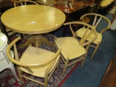 A SET OF FOUR MODERN SCANDINAVIAN STYLE WICKER SEAT CHAIRS AND A TABLE