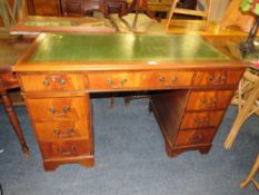 AN ANTIQUE MAHOGANY LEATHER TOPPED TWIN PEDESTAL DESK, W 121 CM