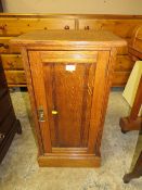 AN EDWARDIAN OAK POT CUPBOARD