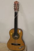 A CHILDS SIZE CHINESE ACOUSTIC GUITAR