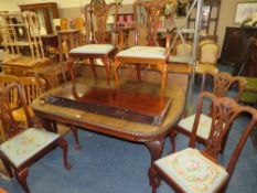 A LARGE EARLY 20TH CENTURY MAHOGANY SIDEBOARD, WIND-OUT DINING TABLE AND 7 CHAIRS ON BALL AND CLAW