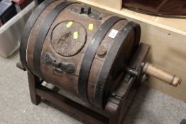 A VINTAGE CHURNING BARREL ON STAND