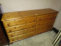 A MODERN HONEY PINE EIGHT DRAWER CHEST W-168 CM