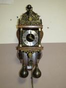 A MODERN DUTCH WALLCLOCK WITH BRASS WEIGHTS
