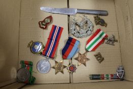 A BOX CONTAINING FOUR WWII MEDALS AND VARIOUS MILITARY ITEMS