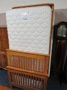 A MODERN SINGLE BED AND MATTRESS WITH PULL-OUT GUEST MATTRESS