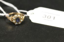 AN ANTIQUE SAPPHIRE AND SEED PEARL GOLD RING - MARKS INDISTINCT - APPROX 4 G
