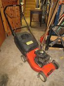 A PETROL LAWN MOWER WITH BOX