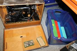 A VINTAGE CASED SINGER SEWING MACHINE AND ACCESSORIES TOGETHER WITH A COLLECTION OF VINTAGE KNITTING