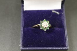 AN 18CT EMERALD AND DIAMOND DRESS RING - APPROX 4G