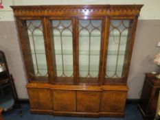 A QUALITY REPRODUCTION WALNUT BREAKFRONT LIBRARY BOOKCASE H-215 W-200 CM