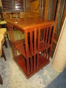 A MAHOGANY INLAID REVOLVING BOOKCASE