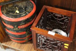 A DECORATIVE ORIENTAL STYLE PLANTER TOGETHER WITH A LACQUERWARE SWING BOX WITH CONTENTS