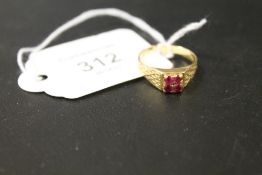 A FOUR STONE RUBY STYLE RING STAMPED 18CT - APPROX WEIGHT 3.5 G