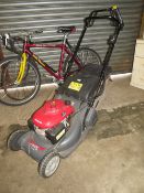 A HONDA PETROL MOWER WITH BOX