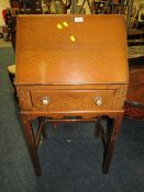 A SMALL VINTAGE OAK BUREAU AND TWO CHAIRS (3)