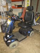 AN INVACARE MOBILITY SCOOTER WITH CHARGER