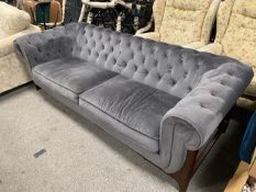 A MODERN UPHOLSTERED CHESTERFIELD STYLE SETTEE