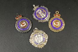 FOUR HALLMARKED SILVER AND ENAMEL LODGE JEWELS