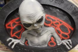 A LARGE ALIEN THEMED DECORATIVE WALL PIECE