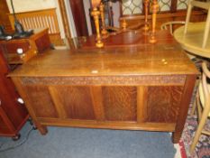 A LATE 19TH / EARLY 20TH CENTURY CARVED OAK COFFER, W 145 CM