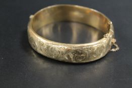 A SILVER BRACELET TOGETHER WITH A METAL CORE 9K BANGLE (2)