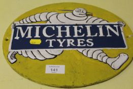 A MODERN REPRODUCTION CAST METAL MICHELIN TYRES PLAQUE