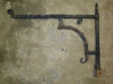 A LARGE CAST IRON WALL BRACKET