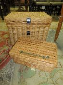 A LARGE WICKER BASKET TOGETHER WITH A SMALLER WICKER HAMPER BASKET