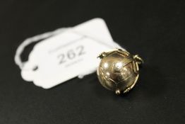 A YELLOW METAL MASONIC PUZZLE BALL - STAMPED MADE IN ENGLAND