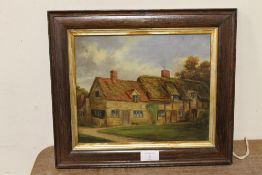 A SMALL FRAMED OIL ON BOARD OF A COUNTRY COTTAGE