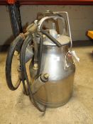 A VINTAGE STAINLESS STEEL MILK BUCKET AND CLUSTER