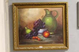 A GILT FRAMED OIL ON CANVAS STILL LIFE STUDY OF A BOWL, FRUIT AND JUG ON A TABLE