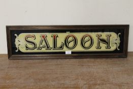 A FRAMED VINTAGE STYLE GLASS SALOON SIGN