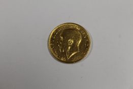 A KING GEORGE V FULL SOVEREIGN DATED 1927 SOUTH AFRICA MINT